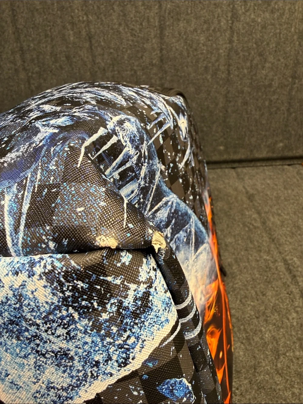 Sprayground Black Backpack with Orange Flame & Blue Ice Graphic